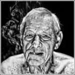 A black and white portrait of an elderly man with deep wrinkles, short hair, and a cigarette in his mouth. Smoke swirls around his head, and he is shirtless against a dark background. His expression is neutral to contemplative.